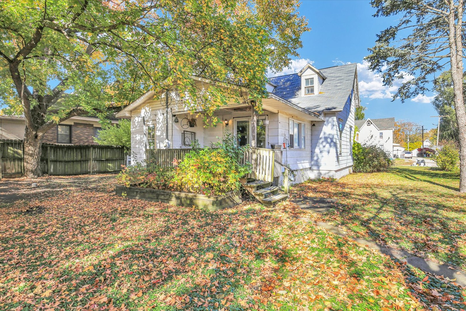 107 Byron Street Sidney, IL 61877 - Photo 28 of 31 a front view of a house with a yard