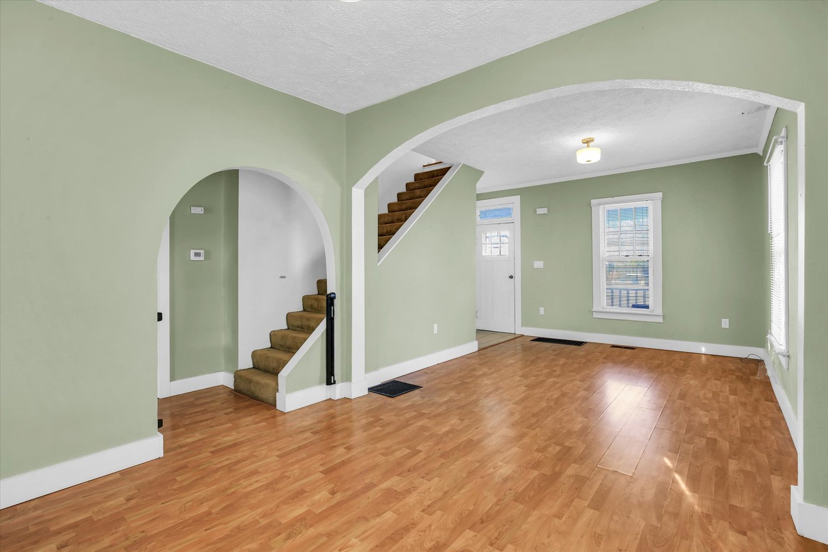 107 Byron Street Sidney, IL 61877 - Photo 10 of 31 a view of empty room with wooden floor