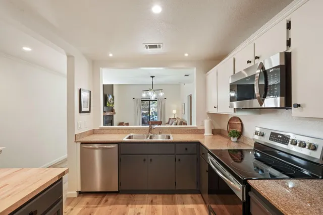 a kitchen with a sink and a refrigerator