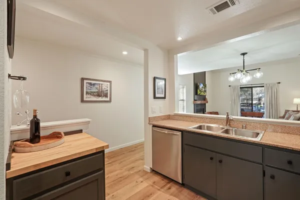 a kitchen with stainless steel appliances granite countertop a sink stove top oven and microwave