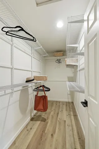 a bedroom with a bed and a lamp