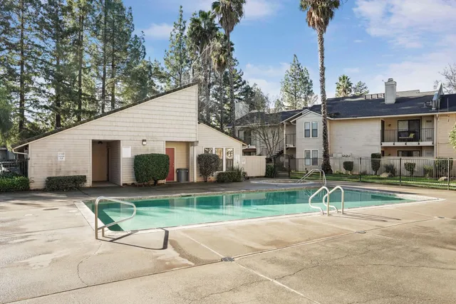 a view of a swimming pool with a lounge chairs