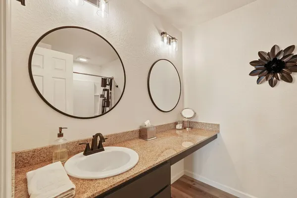 a bathroom with a sink and a mirror
