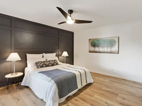 a bedroom with bed and a table