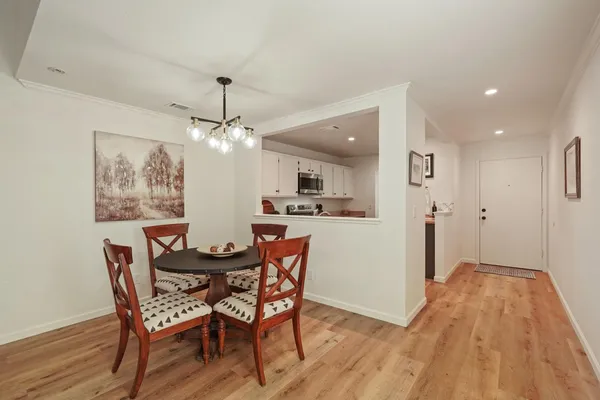 a view of a dining room with furniture window and wooden floor