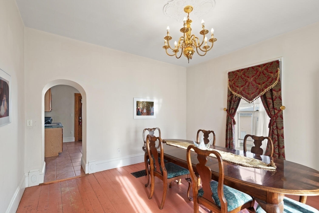 118 Prospect Street Gloucester, MA 01930 - Photo 11 of 36 a view of a dining room with furniture and wooden floor