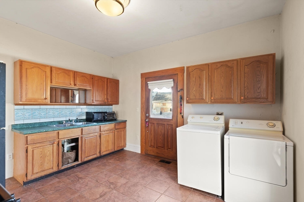118 Prospect Street Gloucester, MA 01930 - Photo 18 of 36 a utility room with sink dryer and washer