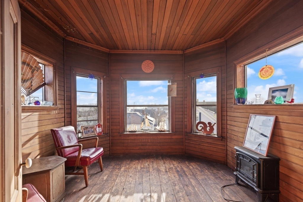 118 Prospect Street Gloucester, MA 01930 - Photo 19 of 36 a living room with furniture and a window