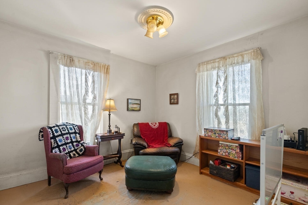 118 Prospect Street Gloucester, MA 01930 - Photo 20 of 36 a living room with furniture and a window