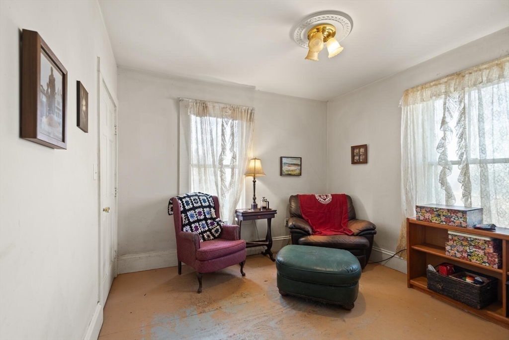 118 Prospect Street Gloucester, MA 01930 - Photo 21 of 36 a living room with furniture and a window