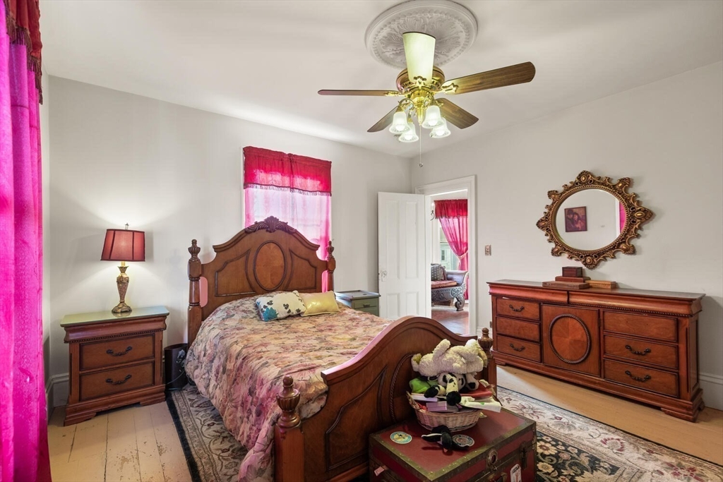 118 Prospect Street Gloucester, MA 01930 - Photo 24 of 36 a bedroom with a bed and dresser