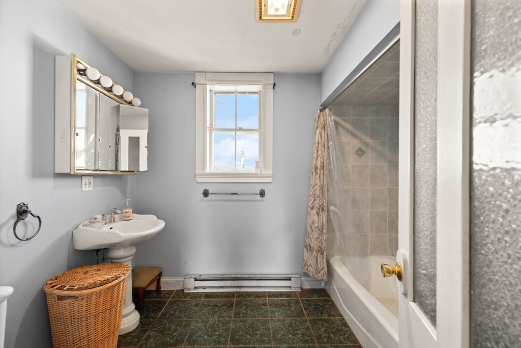 118 Prospect Street Gloucester, MA 01930 - Photo 26 of 36 a bathroom with a sink toilet and shower