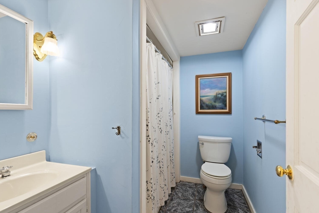 118 Prospect Street Gloucester, MA 01930 - Photo 27 of 36 a bathroom with a toilet sink and mirror