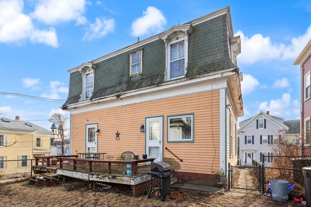 118 Prospect Street Gloucester, MA 01930 - Photo 30 of 36 a front view of a house with large windows
