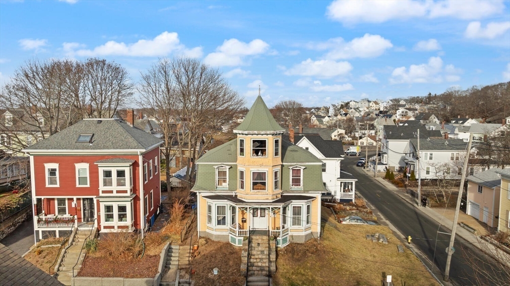 118 Prospect Street Gloucester, MA 01930 - Photo 32 of 36 a view of a large white building with a clock tower in the middle