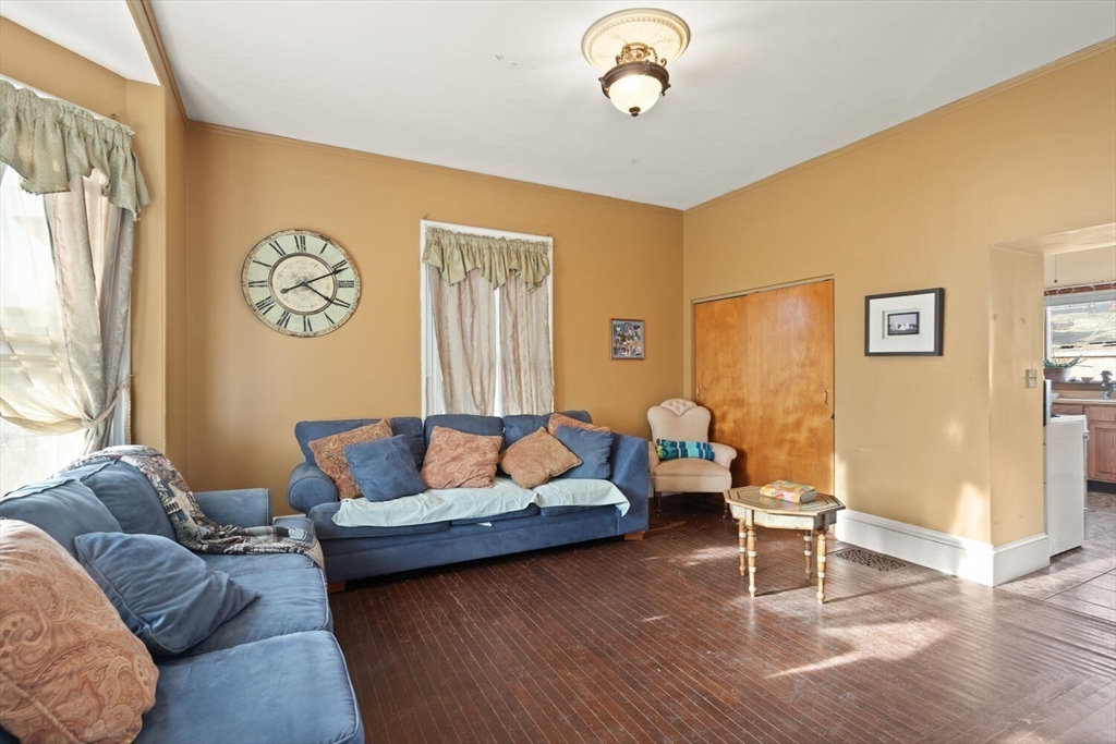 118 Prospect Street Gloucester, MA 01930 - Photo 7 of 36 a living room with furniture and a window
