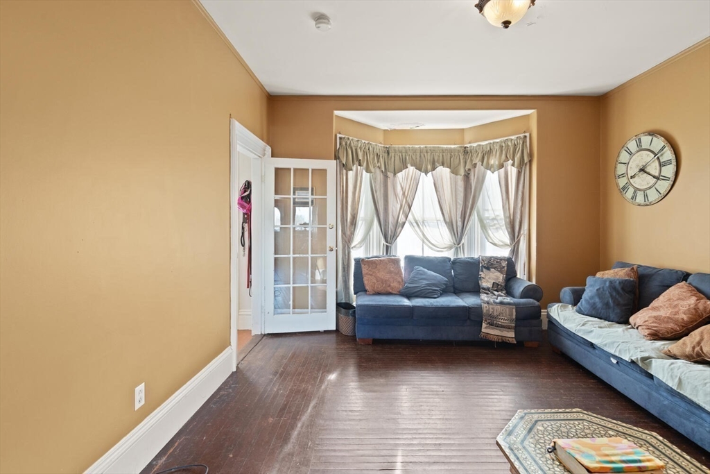 118 Prospect Street Gloucester, MA 01930 - Photo 8 of 36 a living room with furniture and a large window