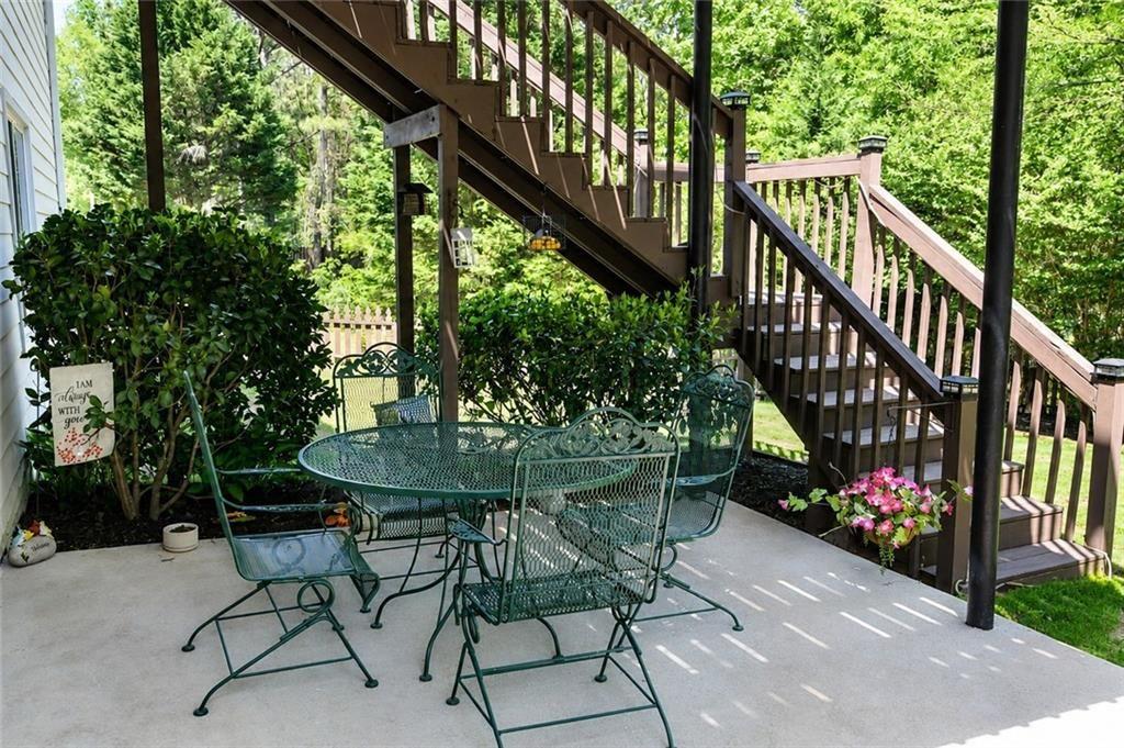 795 Sunset Ridge Lane Southeast Lawrenceville, GA 30045 - Photo 40 of 47 a view of a chairs and tables in the balcony