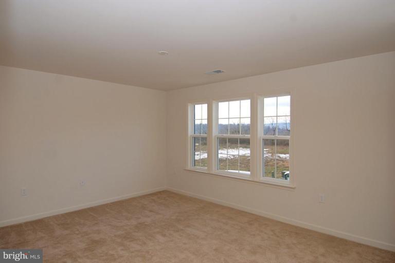 74 Shelby Road Inwood, WV 25428 - Photo 13 of 27 an empty room with a window