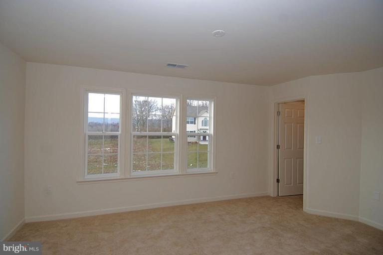 74 Shelby Road Inwood, WV 25428 - Photo 15 of 27 an empty room with a window