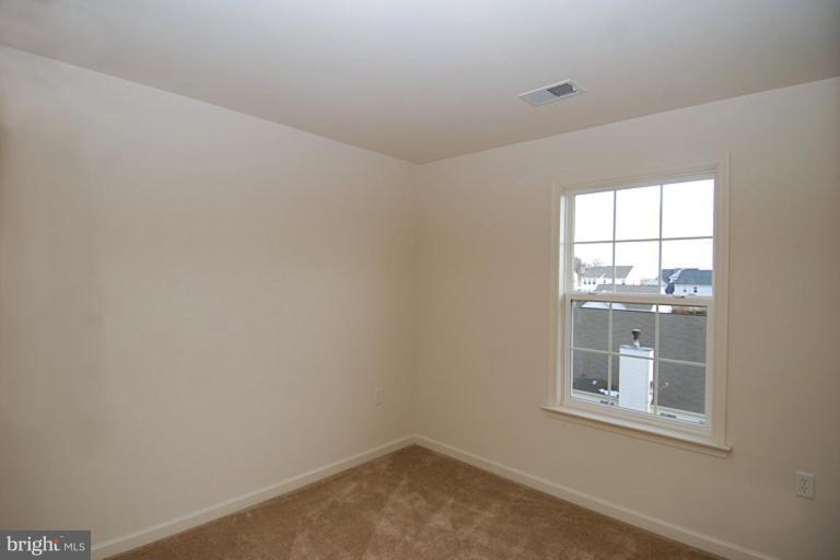 74 Shelby Road Inwood, WV 25428 - Photo 18 of 27 an empty room with a window