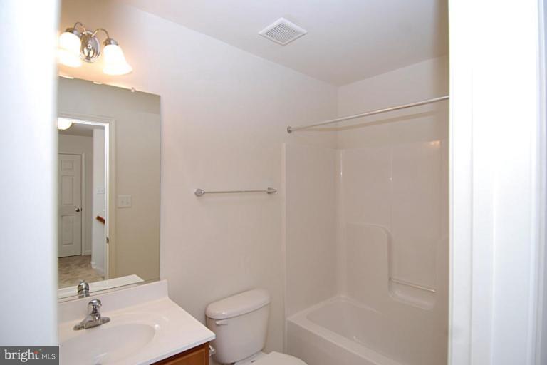 74 Shelby Road Inwood, WV 25428 - Photo 21 of 27 a bathroom with a sink toilet and shower