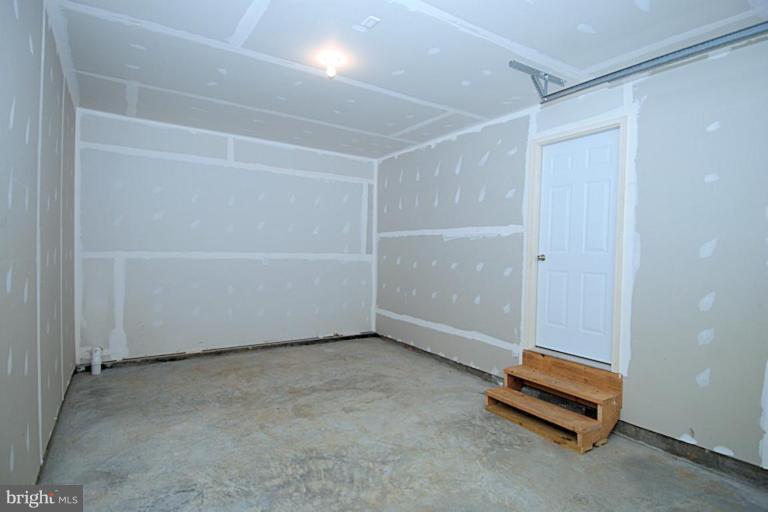 74 Shelby Road Inwood, WV 25428 - Photo 27 of 27 an empty room with windows