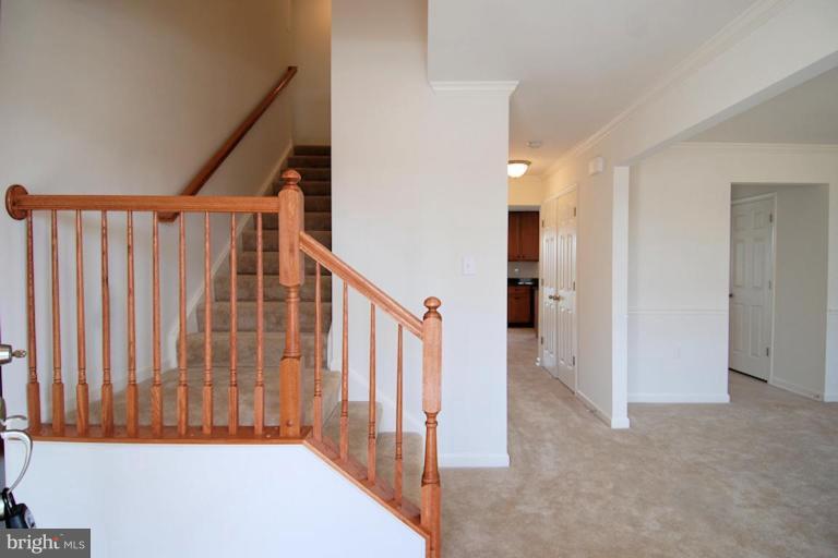 74 Shelby Road Inwood, WV 25428 - Photo 4 of 27 a view of a hallway with staircase