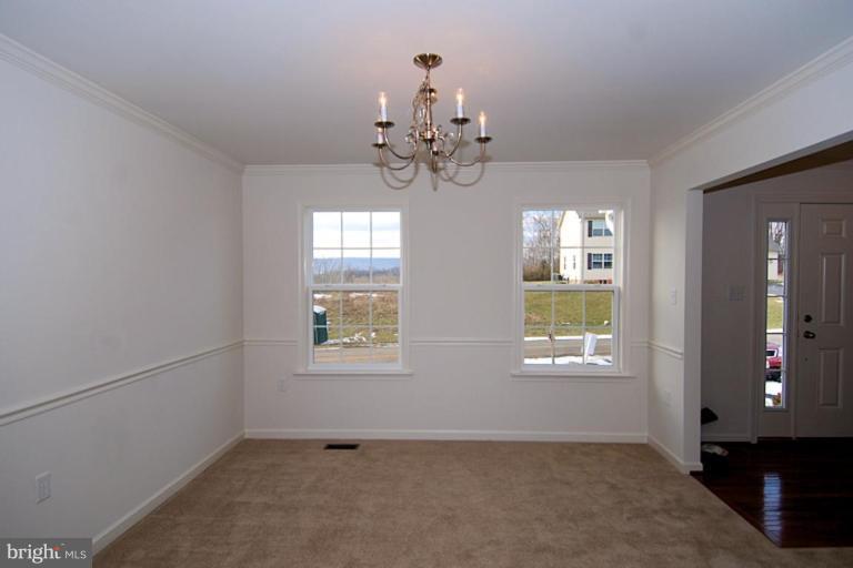 74 Shelby Road Inwood, WV 25428 - Photo 6 of 27 a view of an empty room with a window
