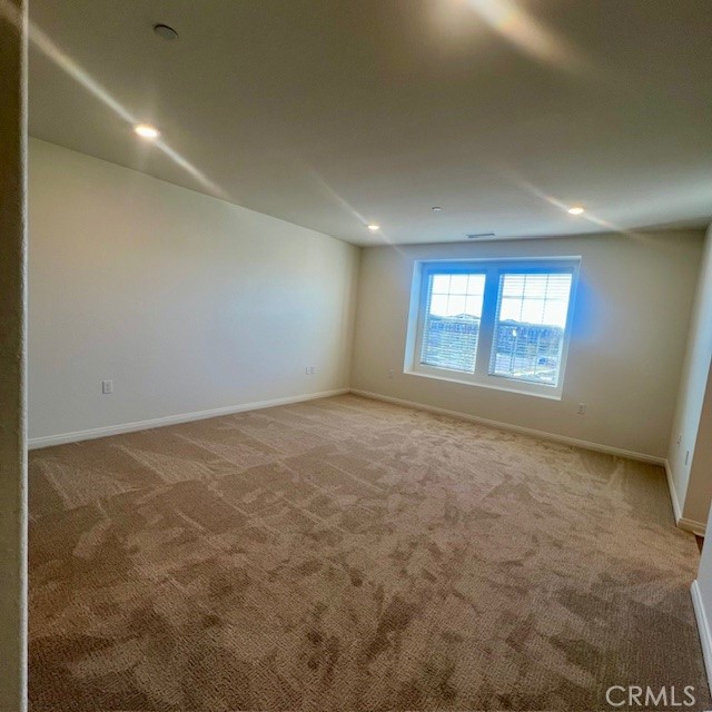 4235 East Rincon Street Ontario, CA 91761 - Photo 15 of 40 an empty room with windows