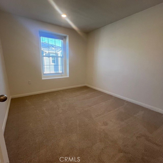 4235 East Rincon Street Ontario, CA 91761 - Photo 24 of 40 an empty room with a window