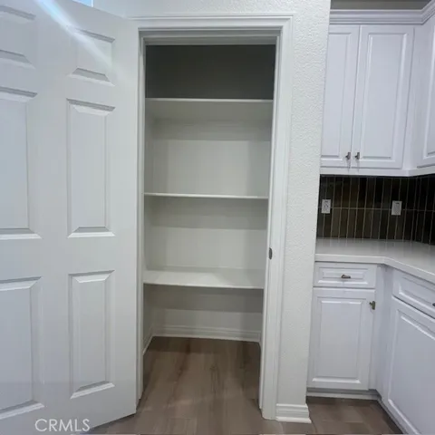 a view of cabinets and window