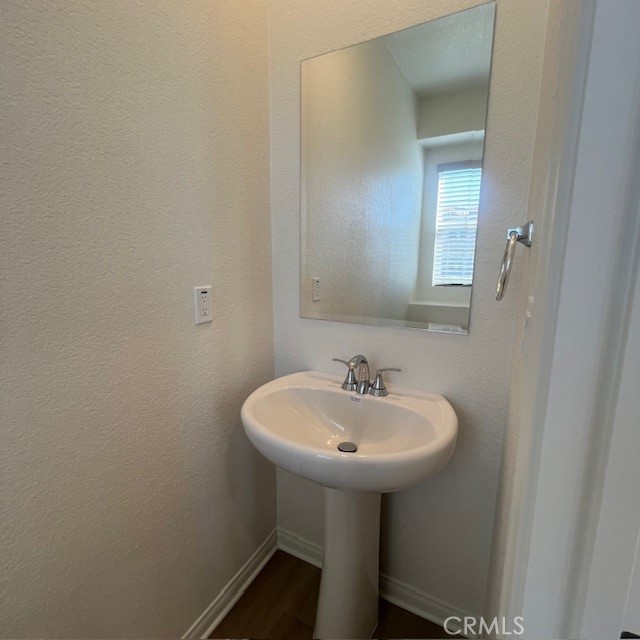 4235 East Rincon Street Ontario, CA 91761 - Photo 9 of 40 a bathroom with a sink and a mirror