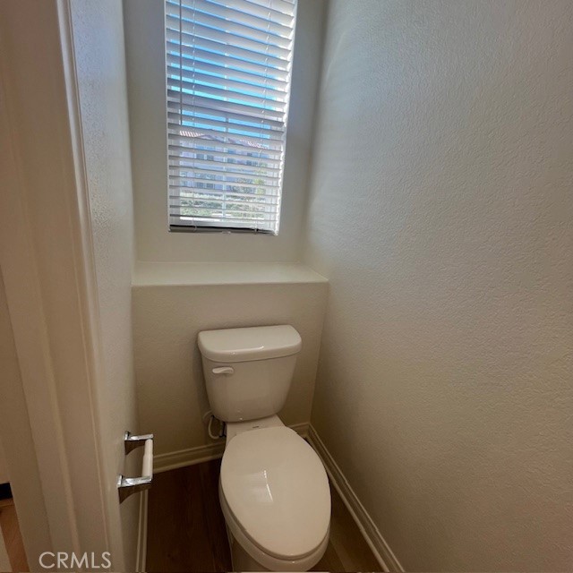 4235 East Rincon Street Ontario, CA 91761 - Photo 10 of 40 a white toilet sitting next to a window
