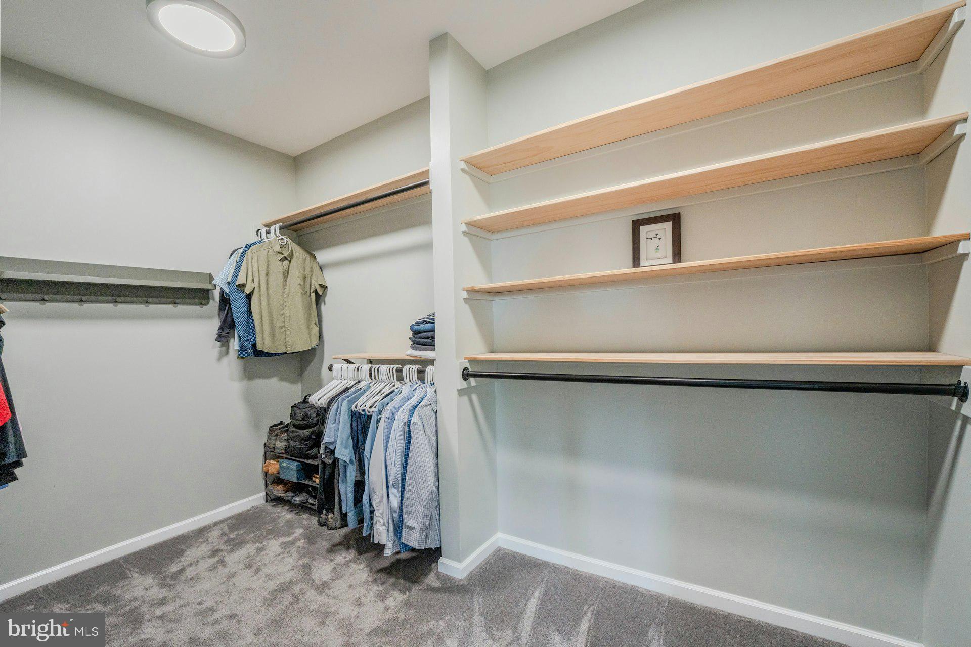 18120 Ridgewood Place Round Hill, VA 20141 - Photo 20 of 46 a view of walk in closet with clothes and shoes