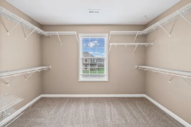 a view of an empty walk in closet