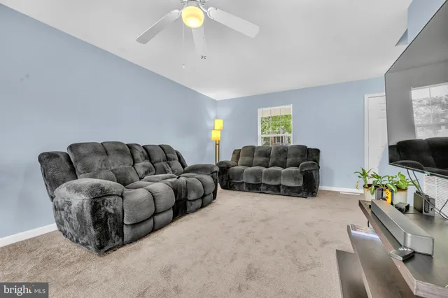 a bedroom with bed and window