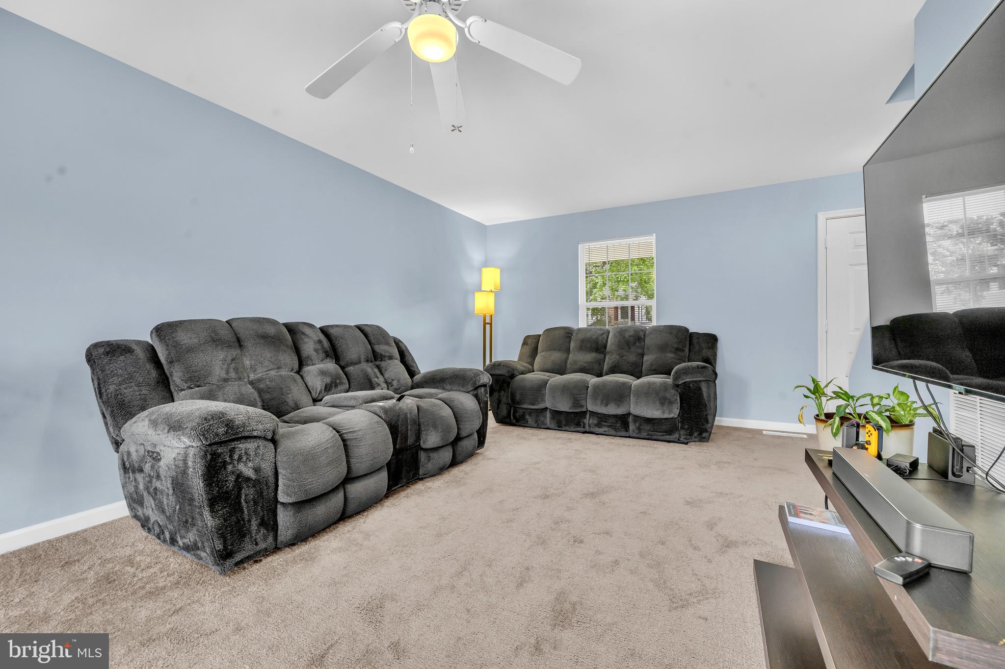 202 Maryland Avenue Ridgely, MD 21660 - Photo 11 of 18 a living room with furniture and a flat screen tv