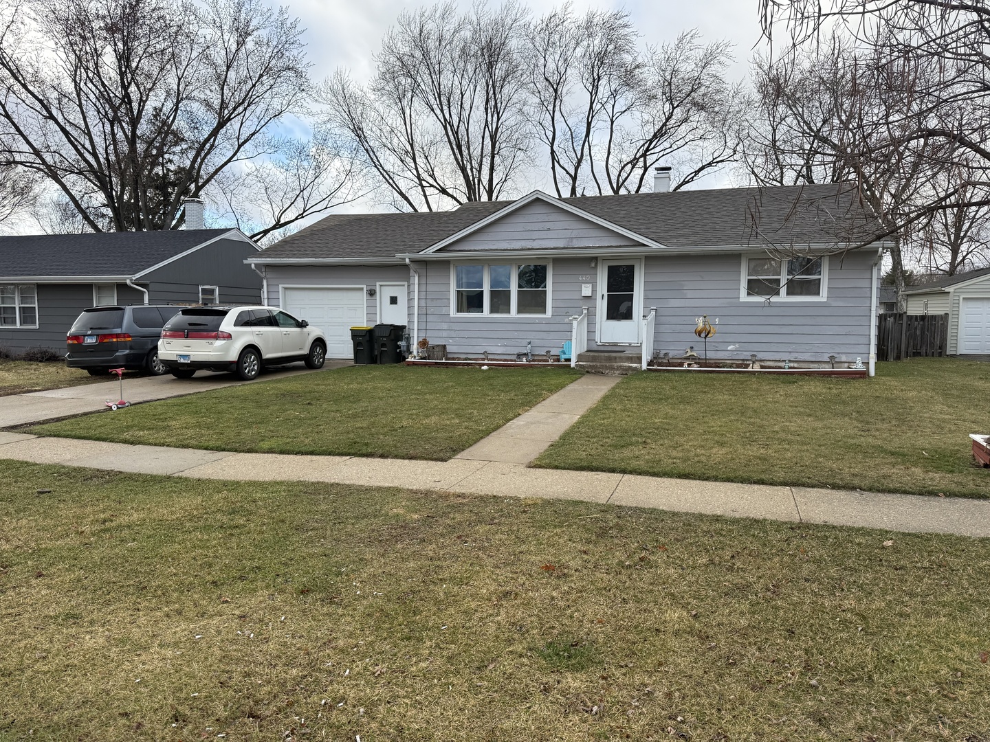 440 West James Way Cary, IL 60013 - Photo 1 of 1 a front view of a house with a yard and garage