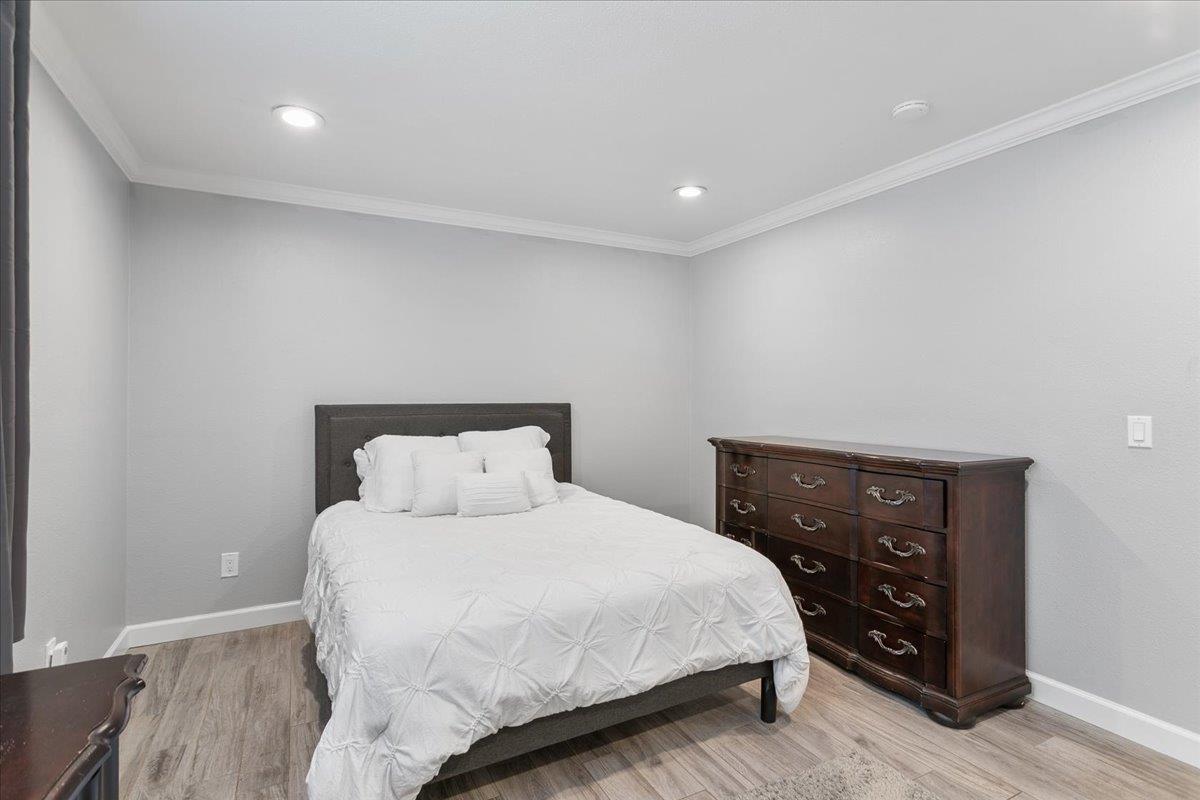 751 Eschenburg Drive Gilroy, CA 95020 - Photo 28 of 39 a bedroom with a bed and a night stand