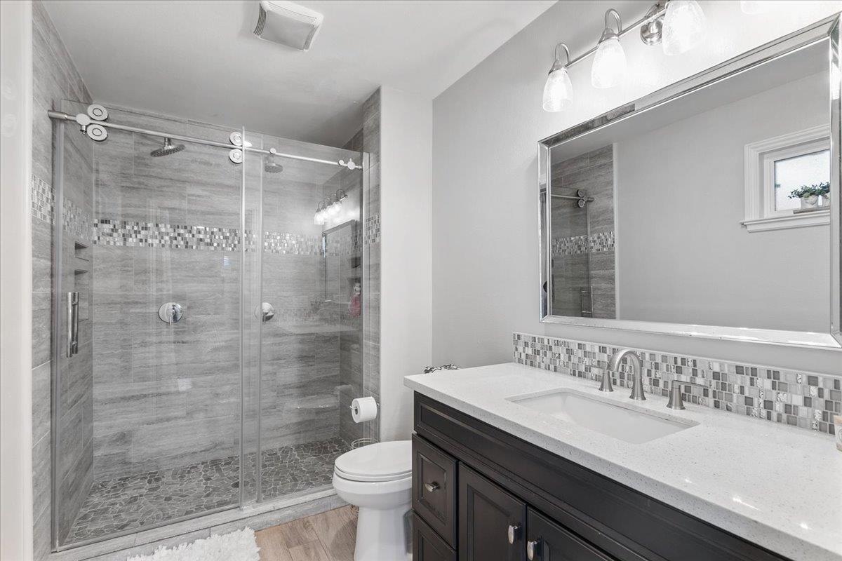 751 Eschenburg Drive Gilroy, CA 95020 - Photo 31 of 39 a bathroom with a sink a toilet and shower