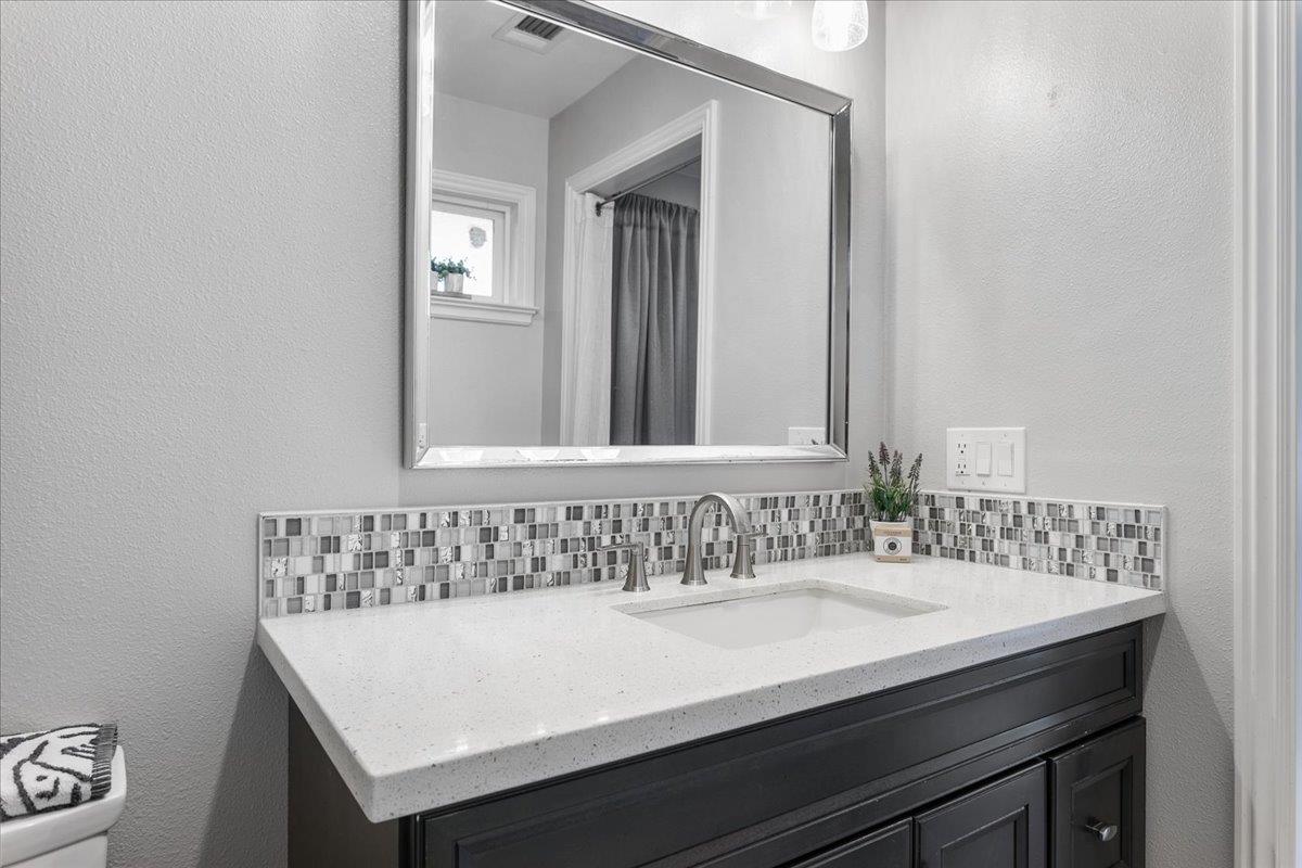 751 Eschenburg Drive Gilroy, CA 95020 - Photo 32 of 39 a bathroom with a sink and a mirror