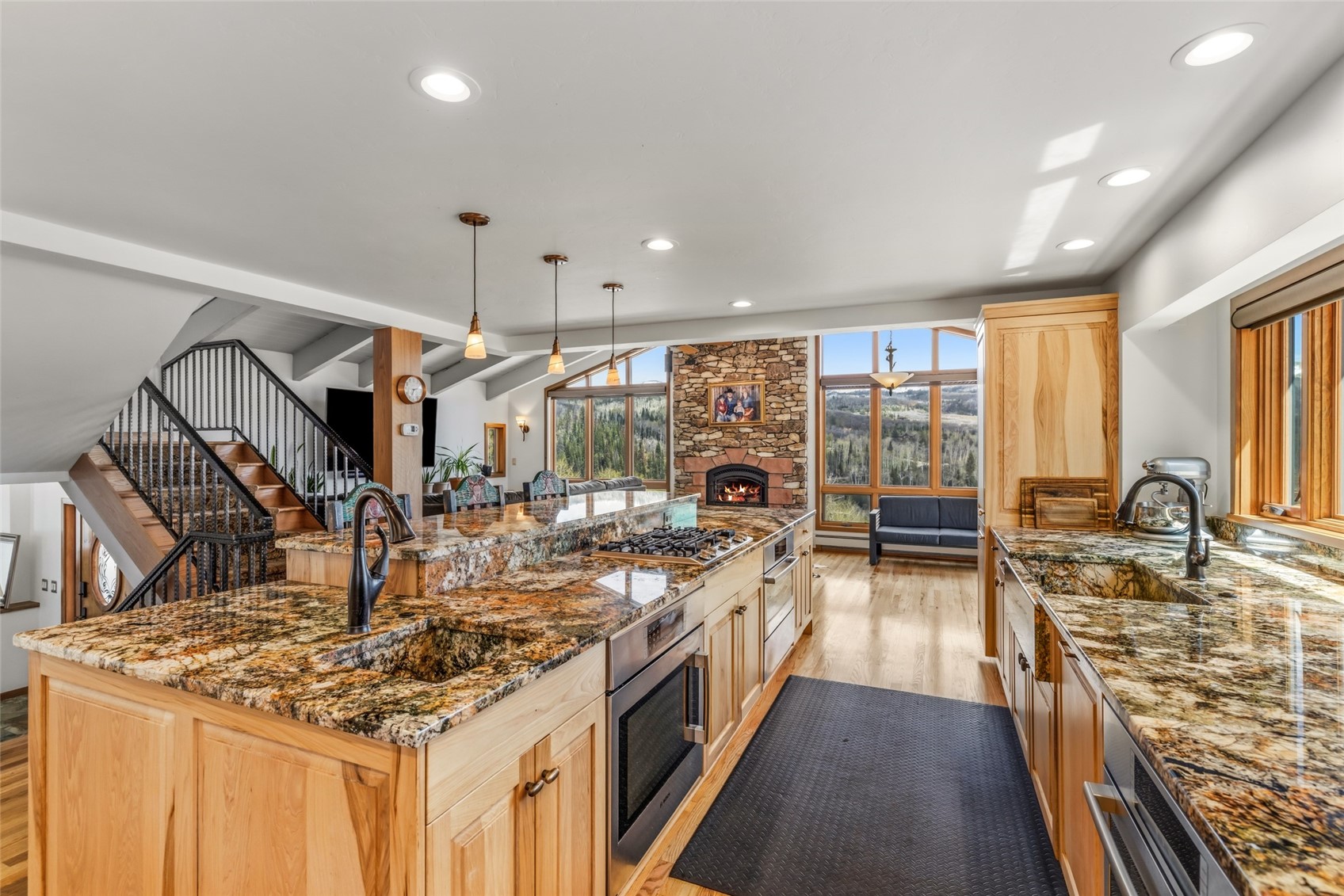 31775 Bradley Ranch Steamboat Springs, CO 80487 - Photo 39 of 49 a kitchen with stainless steel appliances granite countertop a stove and a view of living room