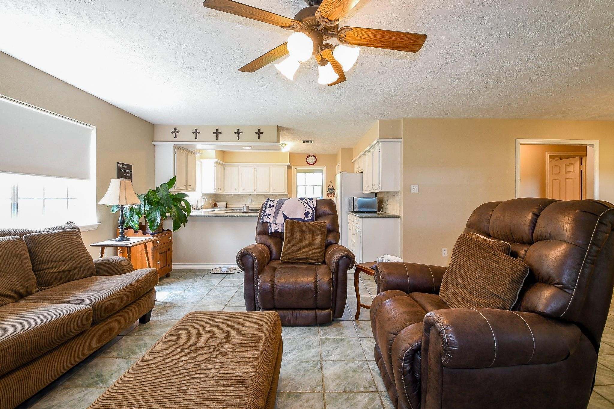 22035 Buescher Road Tomball, TX 77377 - Photo 34 of 43 a living room with furniture ceiling fan and a rug