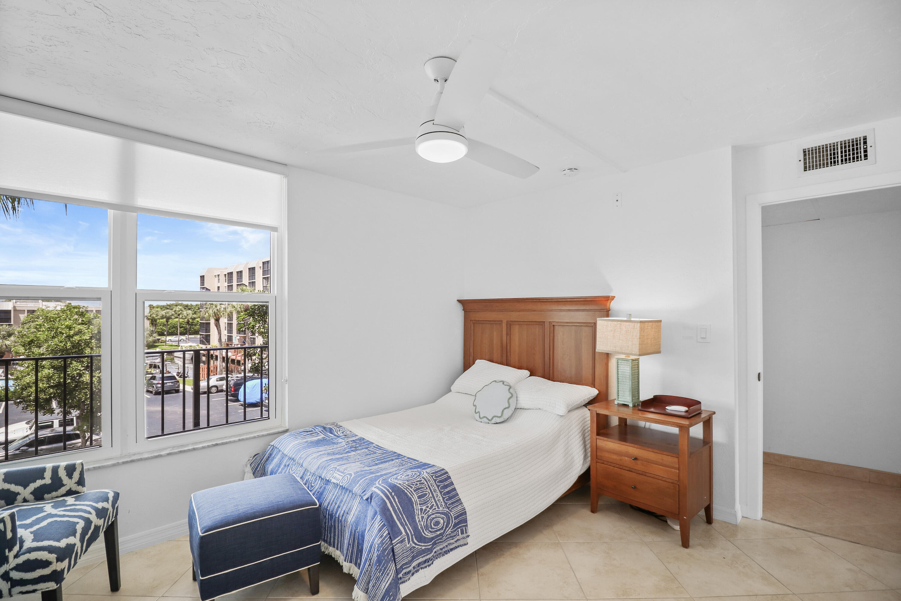 13 Royal Palm Way, Unit 302 Boca Raton, FL 33432 - Photo 17 of 31 a bedroom with a bed and a couch