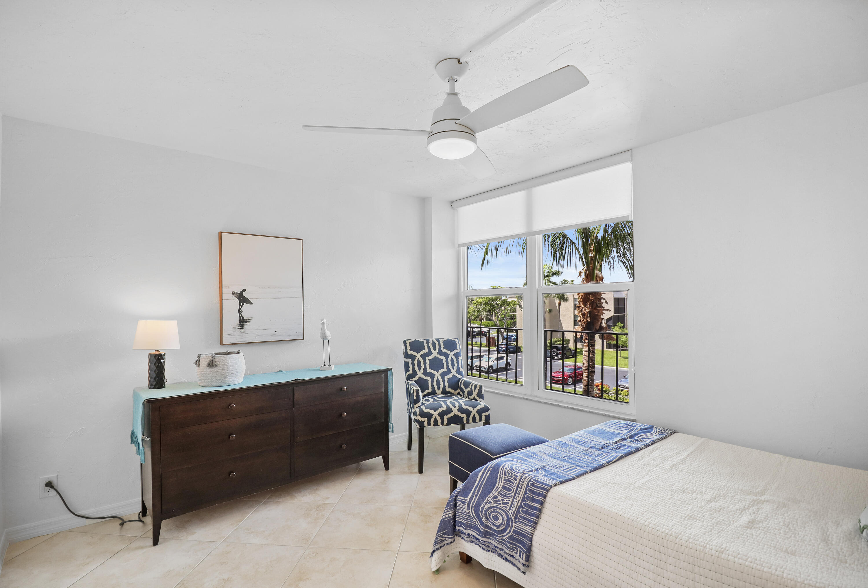 13 Royal Palm Way, Unit 302 Boca Raton, FL 33432 - Photo 18 of 31 a bedroom with a bed window and table