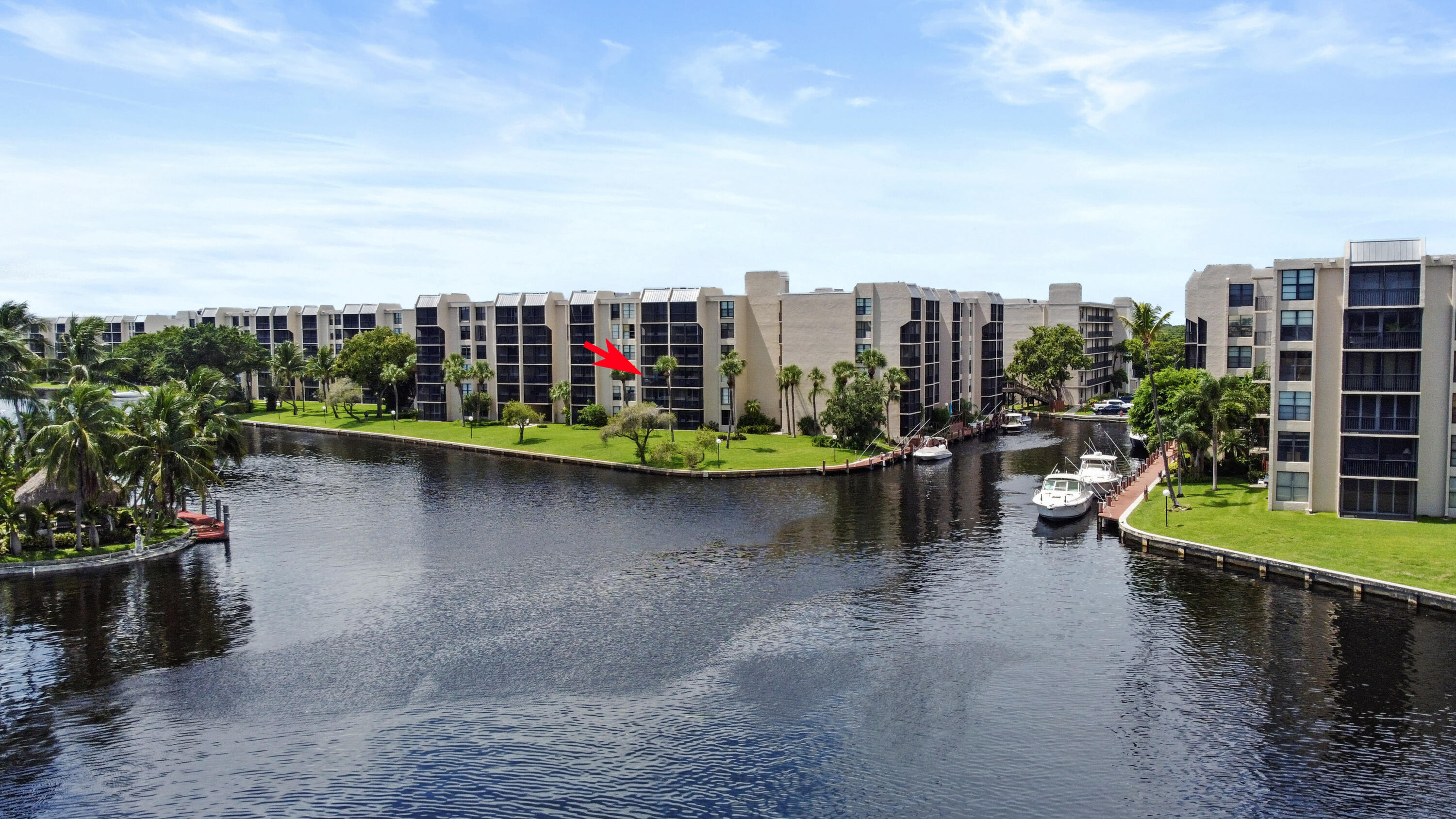 13 Royal Palm Way, Unit 302 Boca Raton, FL 33432 - Photo 22 of 31 a view of a lake with a lawn chairs