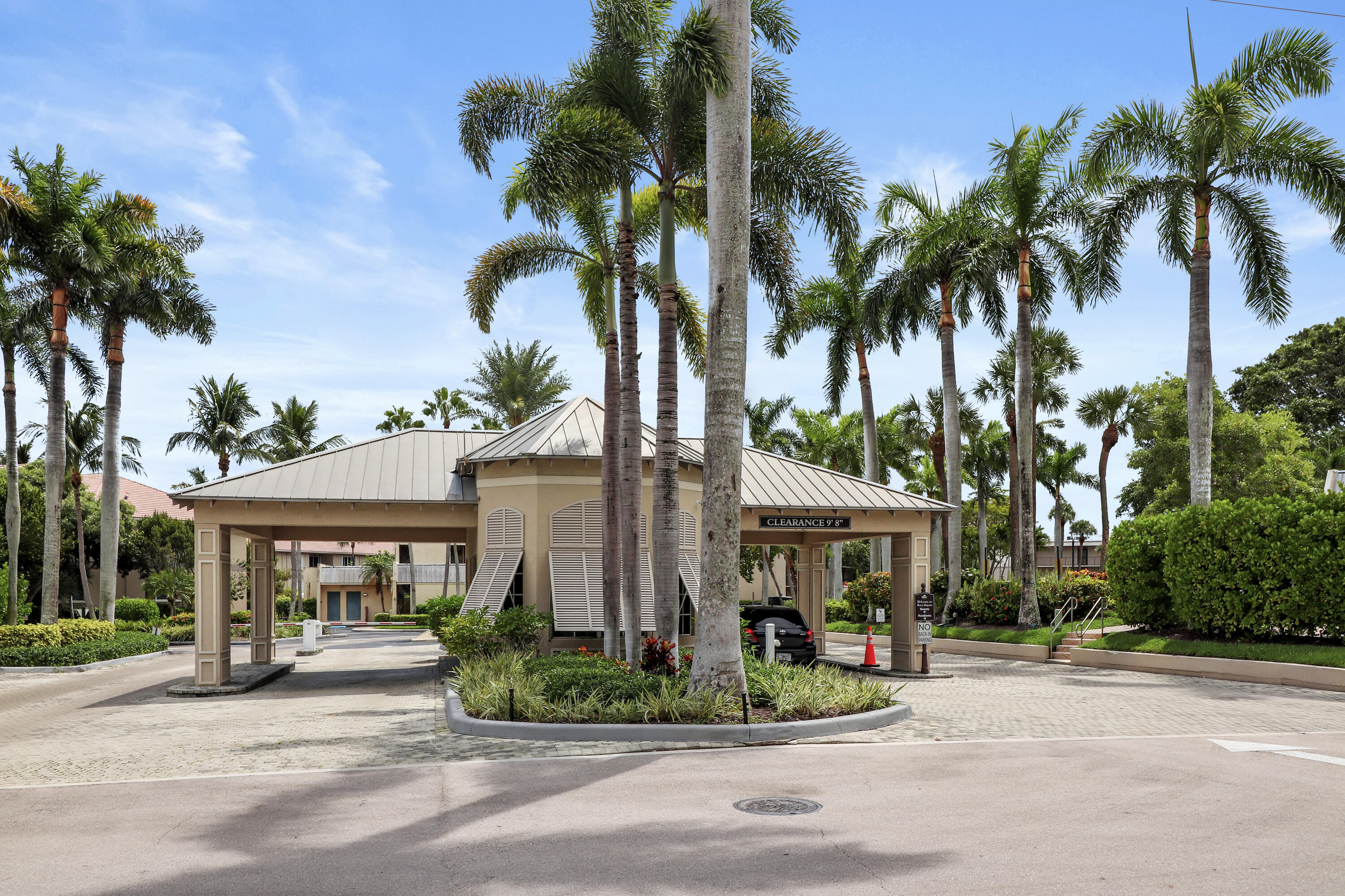13 Royal Palm Way, Unit 302 Boca Raton, FL 33432 - Photo 27 of 31 a front view of house with a garden and patio
