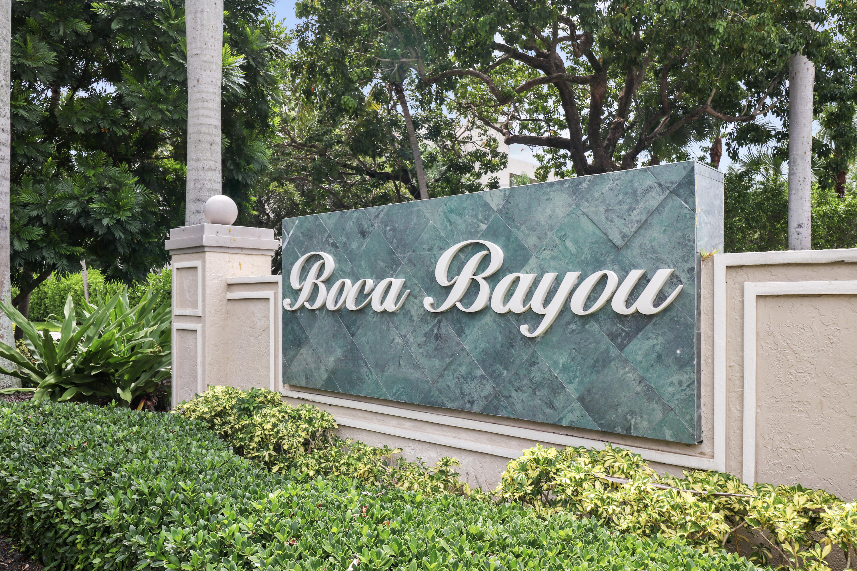 13 Royal Palm Way, Unit 302 Boca Raton, FL 33432 - Photo 28 of 31 a view of a sign board with tall trees