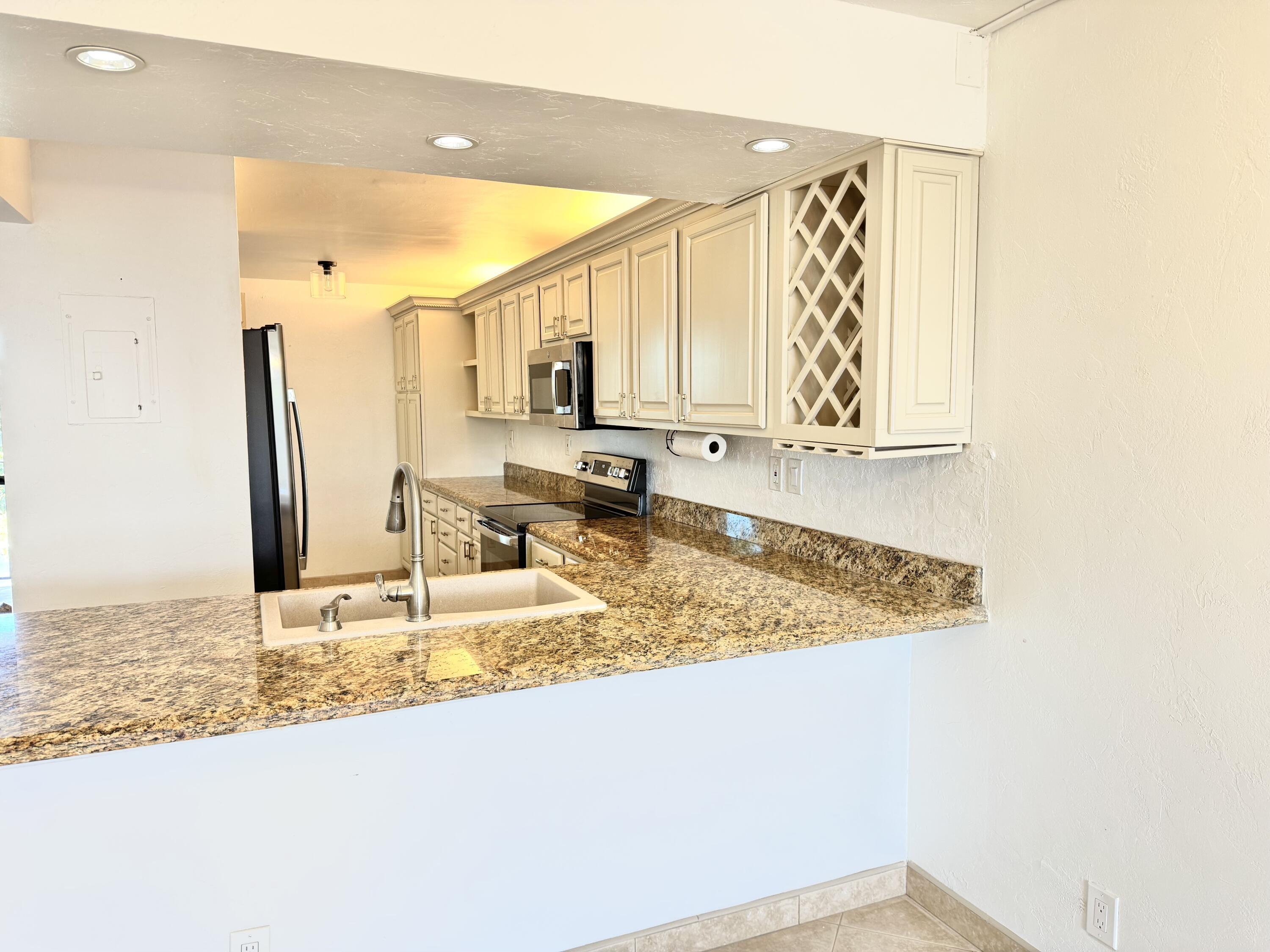 13 Royal Palm Way, Unit 302 Boca Raton, FL 33432 - Photo 6 of 31 a view of a kitchen from a dining room